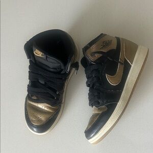 Kids Nike Black and Gold Sneakers